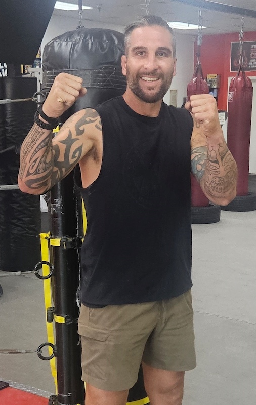 boxing coach Rich Power posing for a photo at Poway Martial Arts Poway CA